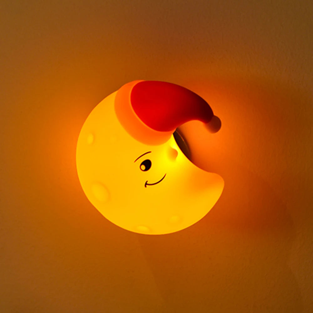 Star-shaped silicone LED night light by Showlu Smart General, glowing softly in a dark room with a friendly star design.