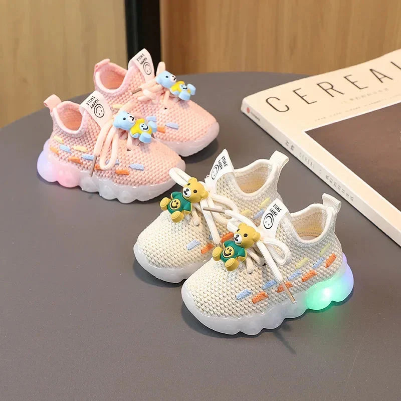 Kids luminous LED sneakers by Showlu Fashion, unisex PU leather shoes with glowing light-up soles and stylish design.