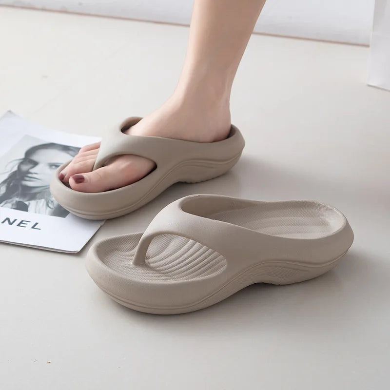 Women's thick platform EVA flip flops in soft cloud beach sandals style with cushioned soles and open-toe design.