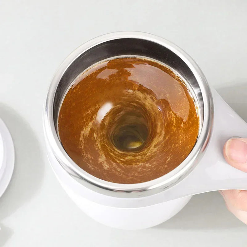 Rechargeable electric magnetic coffee stirring cup by Showlu Fashion, with sleek design and touch control for easy beverage mixing.
