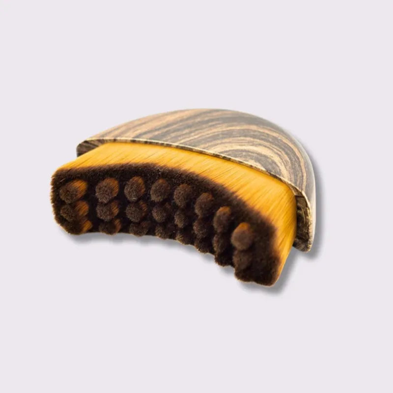 Lymphatic contour face brush from Stone's Store with soft bristles for facial massage and skin contouring therapy.