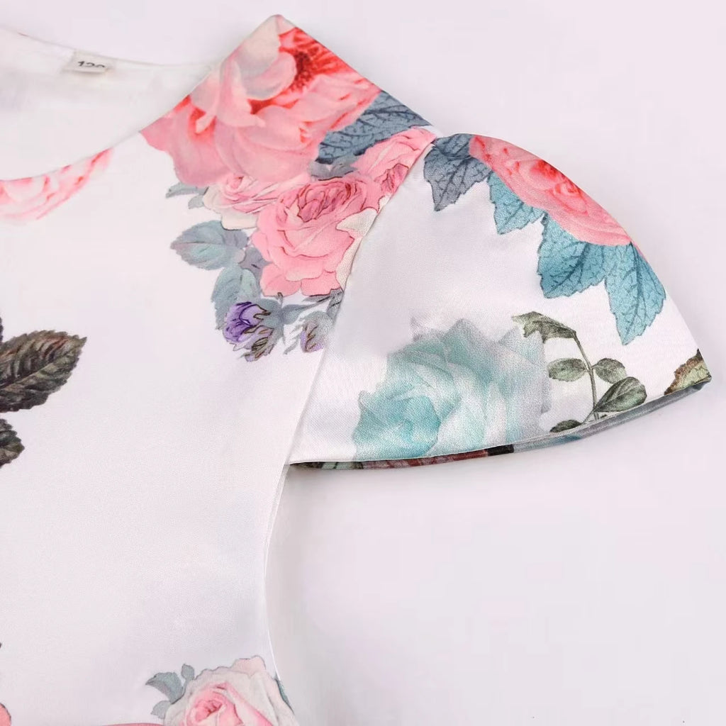 Girls' rose print dress by Showlu Fashion Store featuring a bow, perfect for holiday parties and princess costume performances.