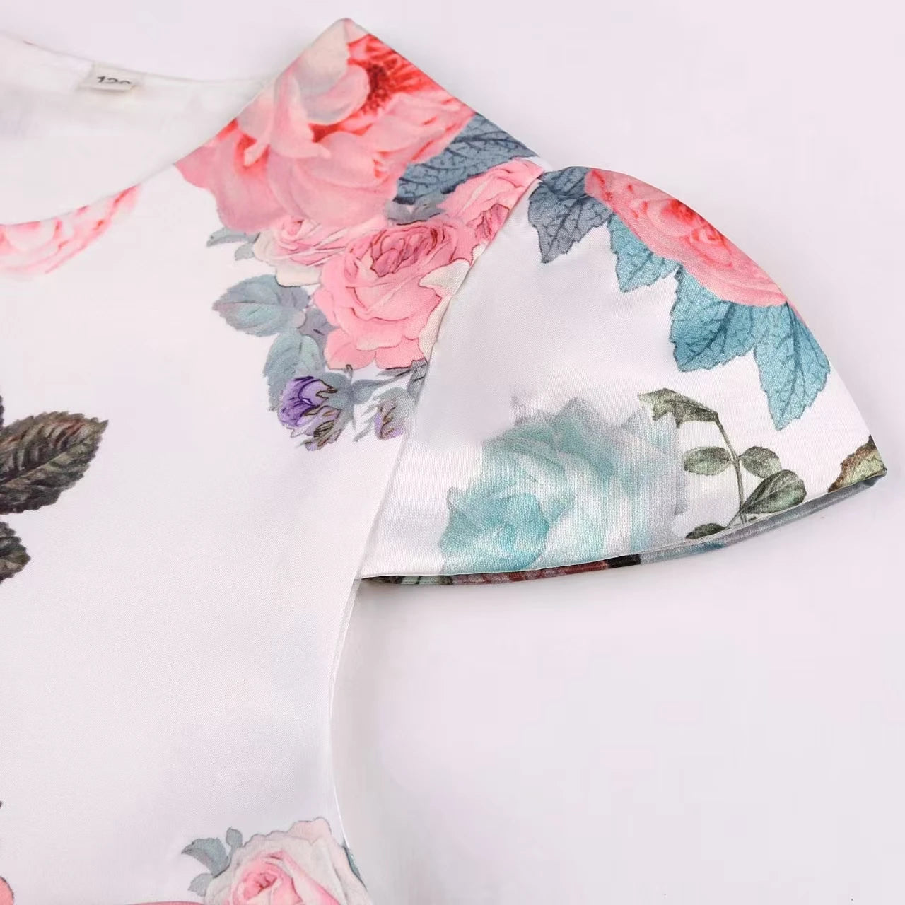 Girls' rose print dress by Showlu Fashion Store featuring a bow, perfect for holiday parties and princess costume performances.