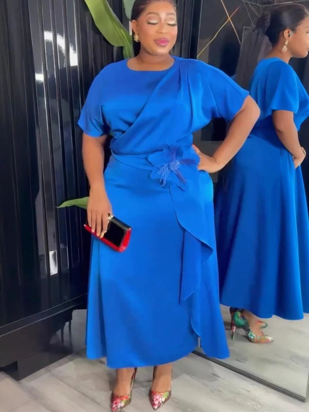 Elegant plus size African Dashiki Ankara gown with vibrant patterns and flowing long design, perfect for stylish occasions.