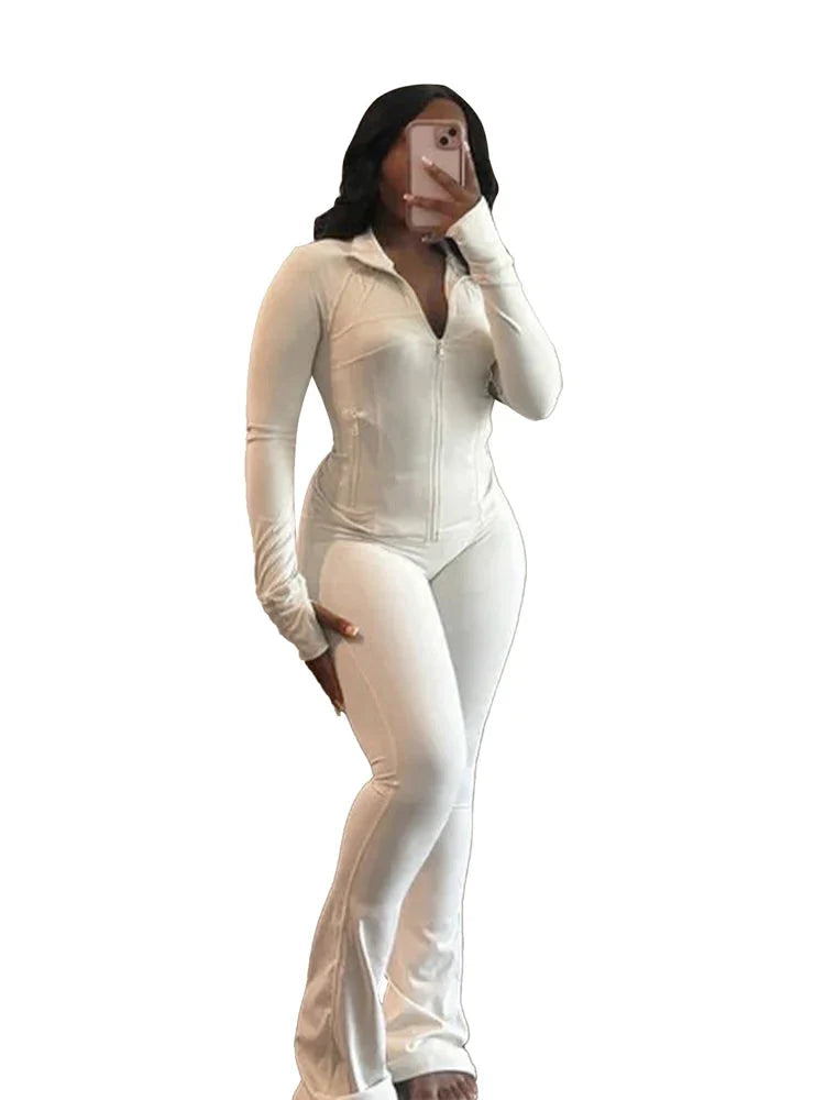 JENYAGE Women's two-piece tracksuit with flared pants and zip-up top, shown in black on a model for casual athletic wear.