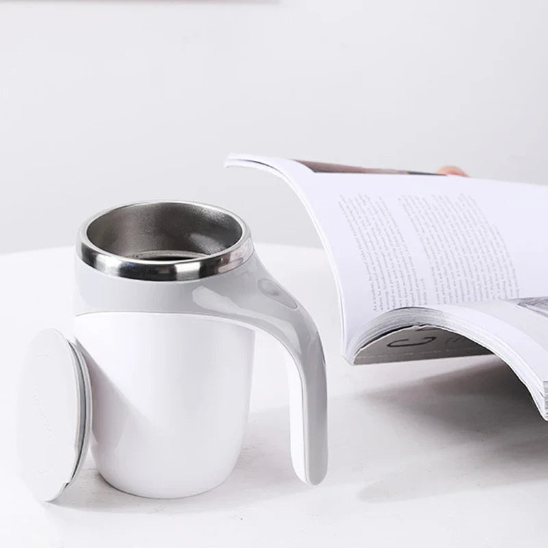 SHOWLU Automatic Stirring Coffee Mug with stainless steel body and rechargeable feature, showing the sleek mug on a table.