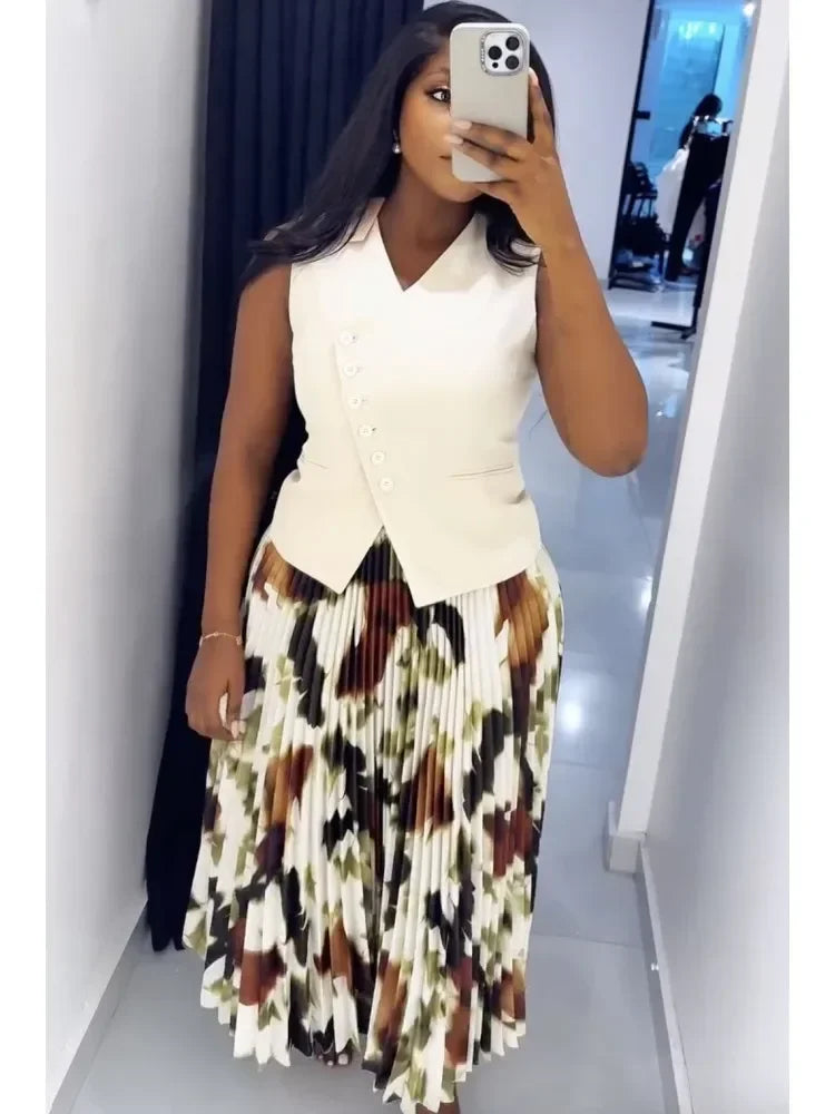 African two-piece outfit with a dashiki top and pleated skirt, traditional Ankara kaftan for women’s wedding or party attire.