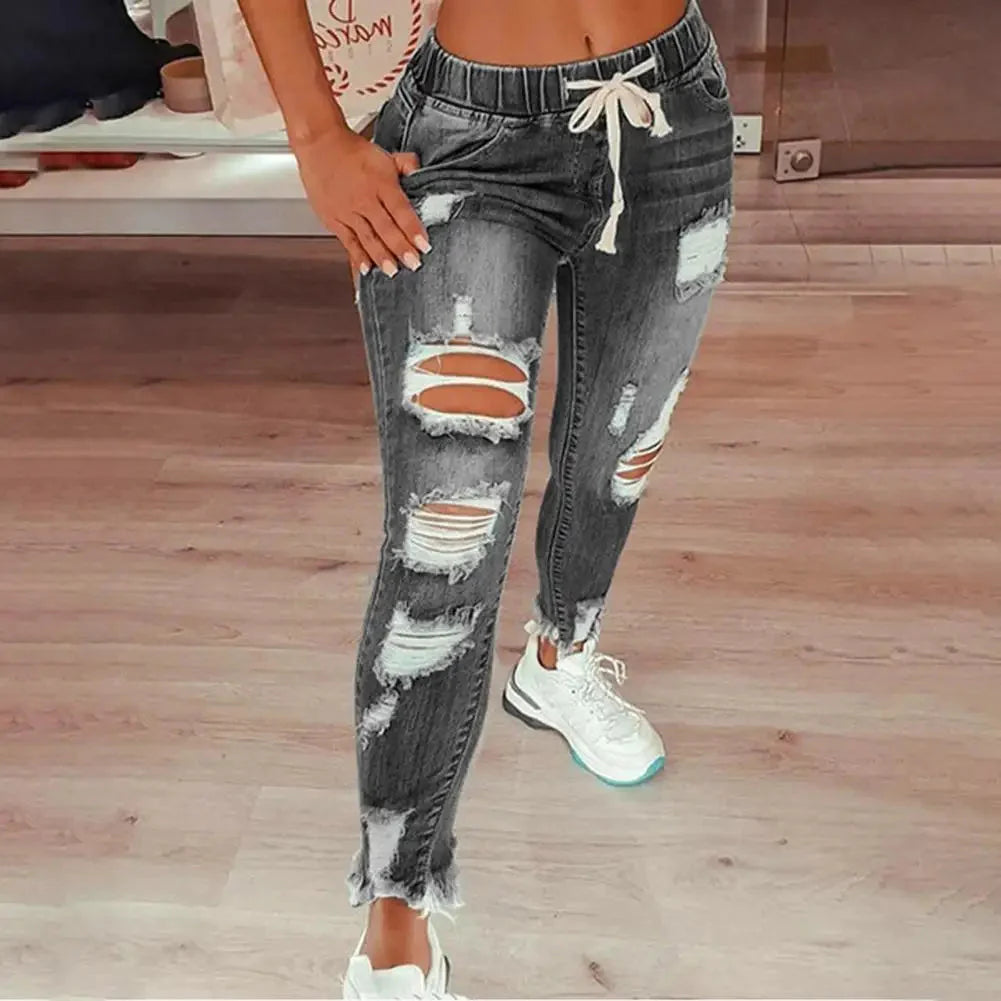 SANWOOD women's ripped hole stretchy skinny jeans with high waist denim, showcasing a fitted, fashionable look.