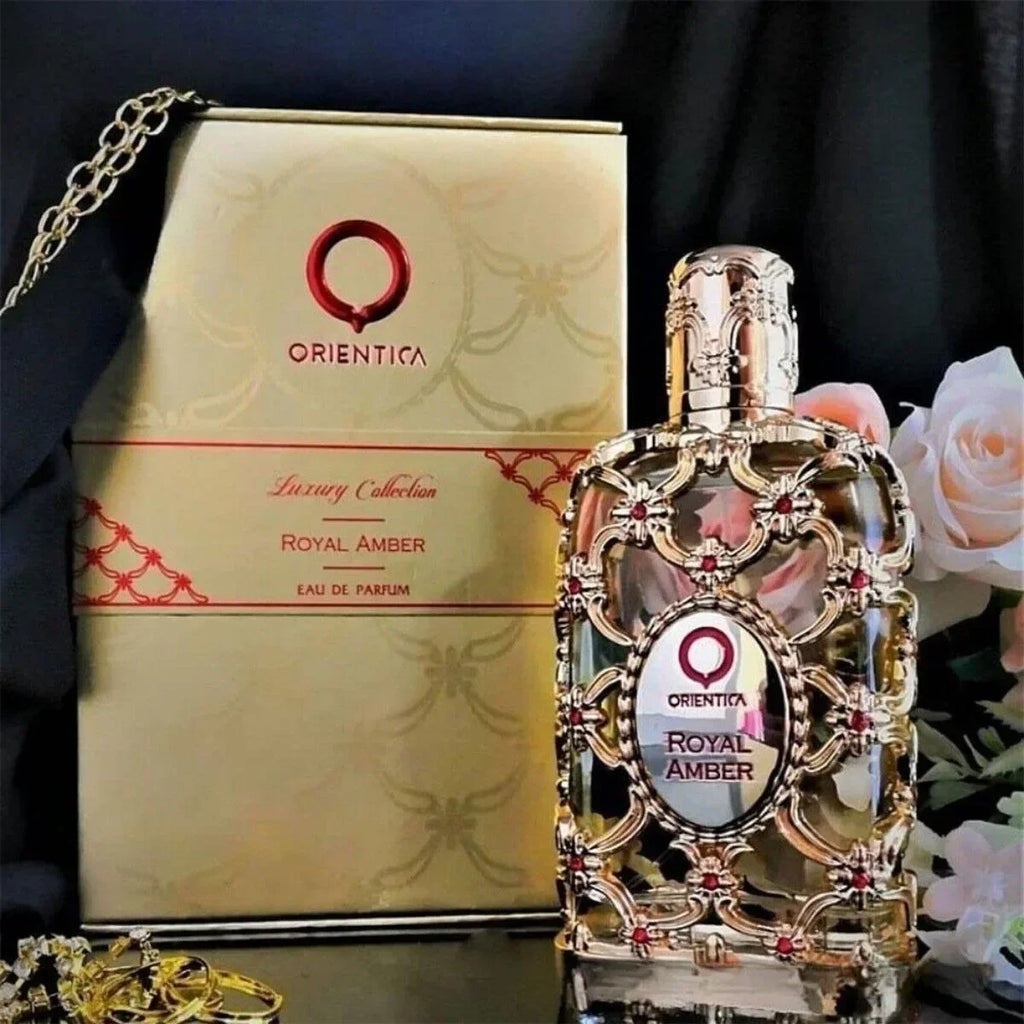 Unisex floral fragrance DJBS Royal Amber Eau De Parfum 2.7 oz with elegant bottle, showcasing warm amber and floral notes.