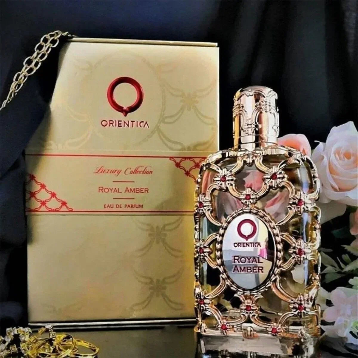 Unisex floral fragrance DJBS Royal Amber Eau De Parfum 2.7 oz with elegant bottle, showcasing warm amber and floral notes.