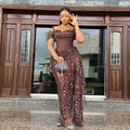 Elegant brown lace evening gown with beads, traditional African wedding dress, designed for brides and special occasions.