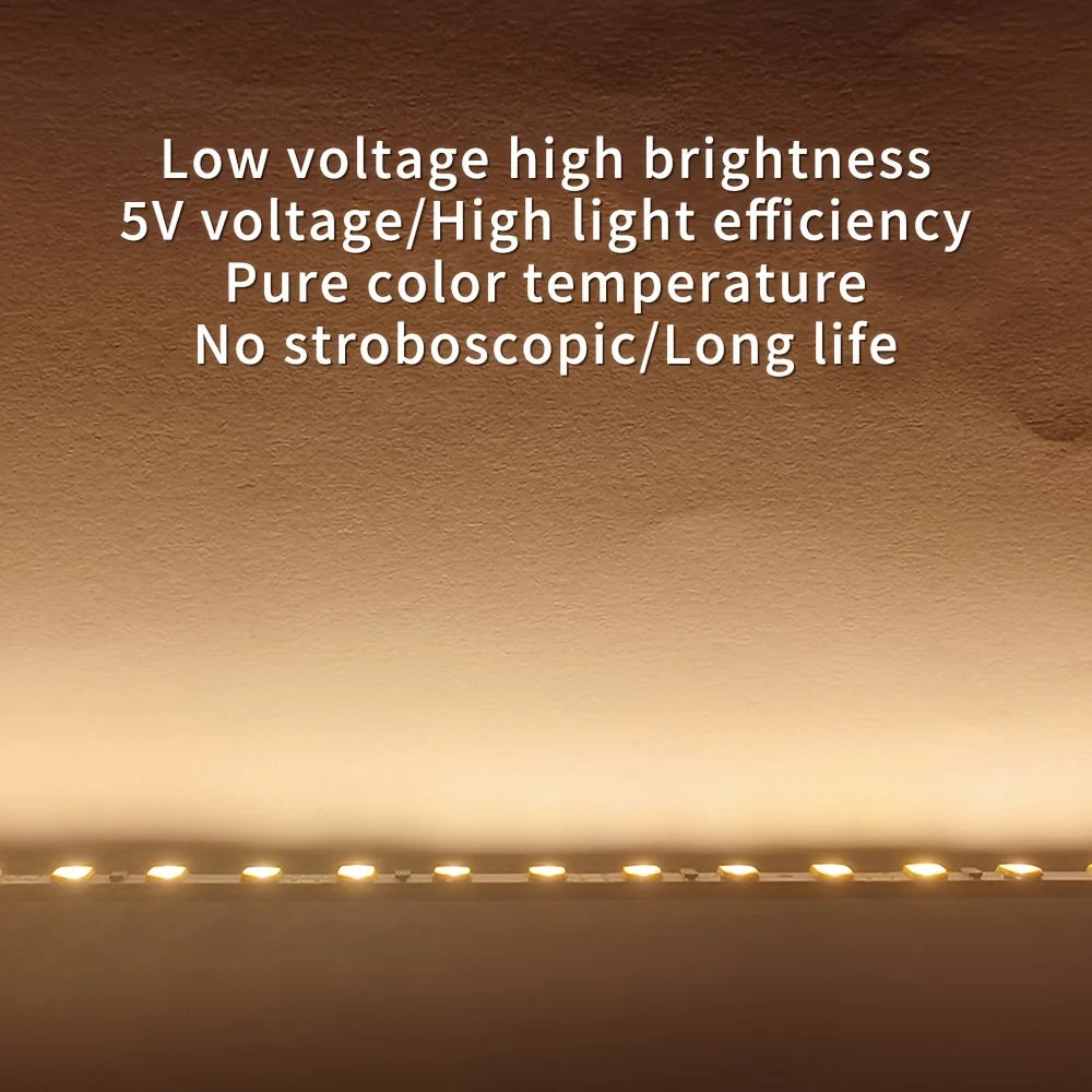 Flexible USB LED strip light in warm white from Showlu Smart General, showcasing the 5V tape with illuminated LEDs.