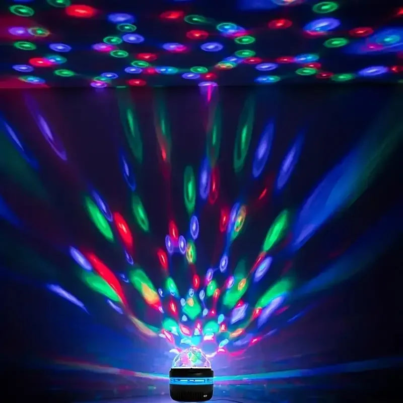 Showlu Smart Crystal Magic Ball LED Night Light glowing with colorful lights in a dark room.