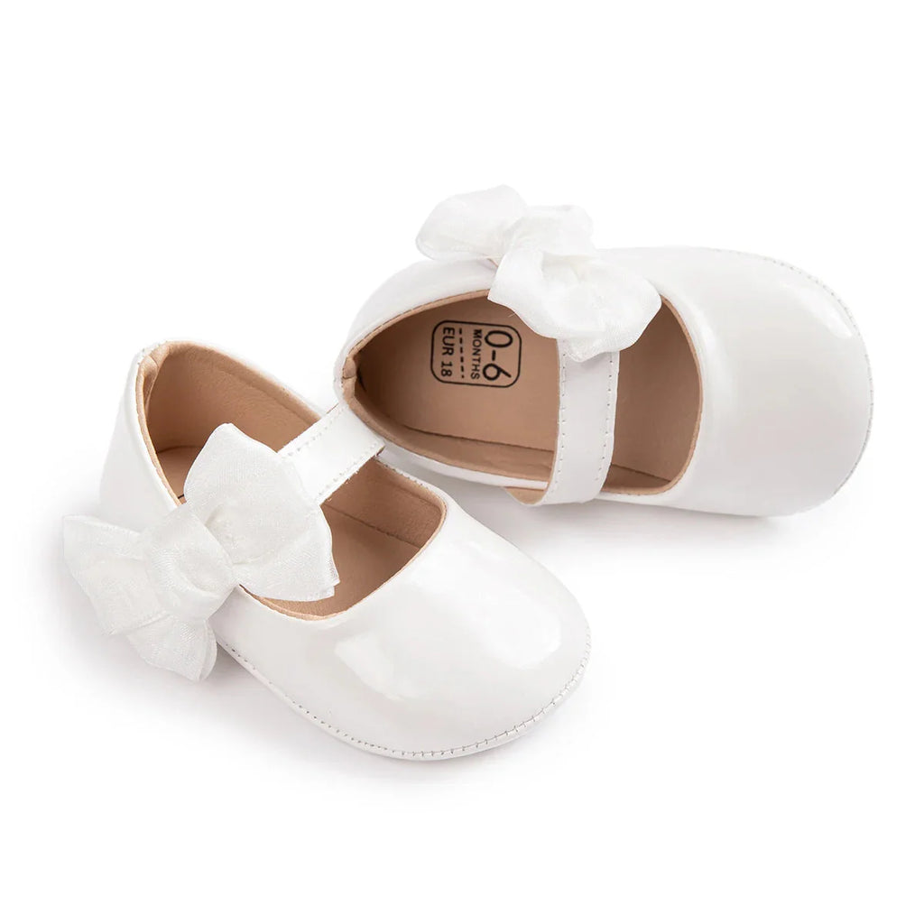 Baby girl PU leather bowknot shoes from Meckior, non-slip first walkers in pink with cute bow details and soft sole for early steps.