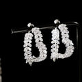 SHOWLU FASHION zircon leaf stud earrings featuring Korean-style copper jewelry with intricate leaf design and sparkling zircon accents.
