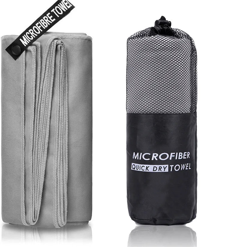SHOWLU microfiber sports towel laid out, quick-drying and soft, suitable for gym, swimming, and beach activities.