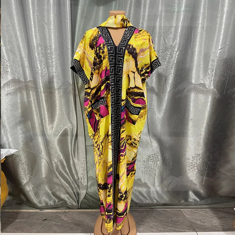 Elegant 2026 African dress for women featuring traditional dashiki and Ankara fabric, long maxi gown with vibrant patterns.