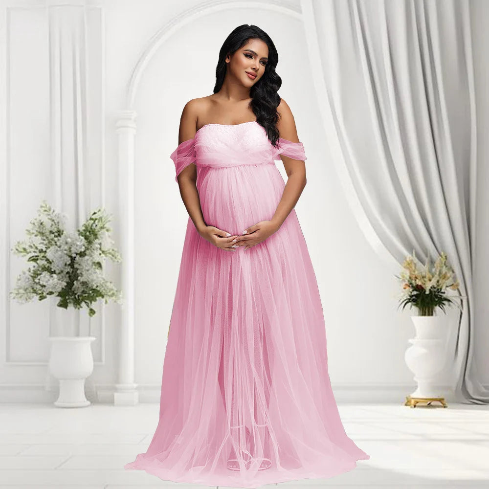 Off-shoulder Showlu Lace Mesh Maternity Gown, a stylish pregnancy photo dress with delicate lace and flowing fabric.