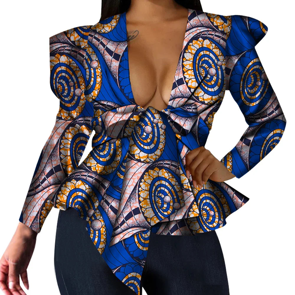 African print women's dashiki top with V-neck and long sleeves, made of cotton, featuring bold traditional patterns.