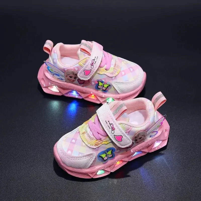 Pink PU leather Elsa Frozen girls' LED lighted sneakers with glitter accents and adjustable straps, perfect for little Disney fans.