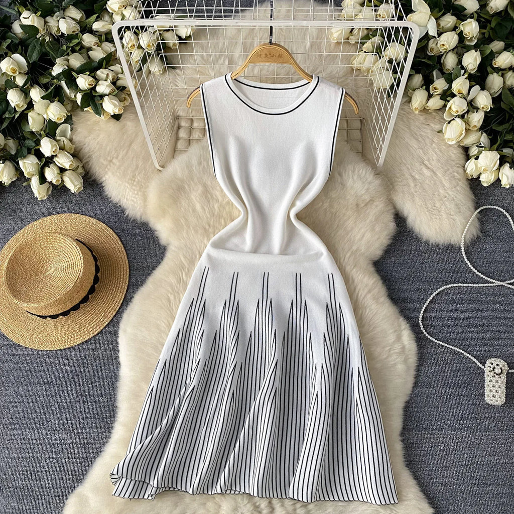 Showlu Fashion women's sleeveless mini dress with A-line bodycon fit, round neck, knitted fabric, perfect for streetwear and parties.