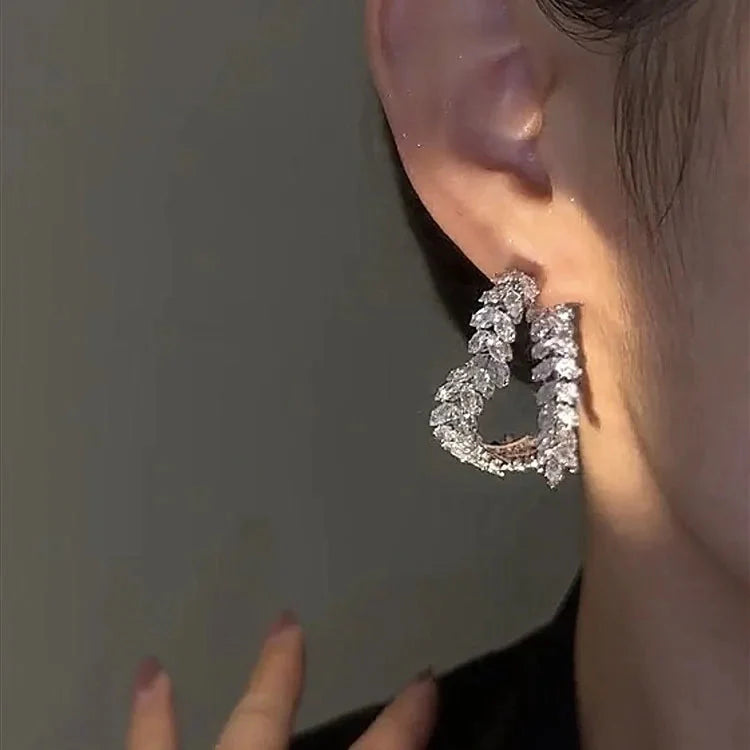 DINGABIYU zircon flower stud earrings with crystal leaf design, showcasing elegant jewelry craftsmanship and sparkling gemstones.