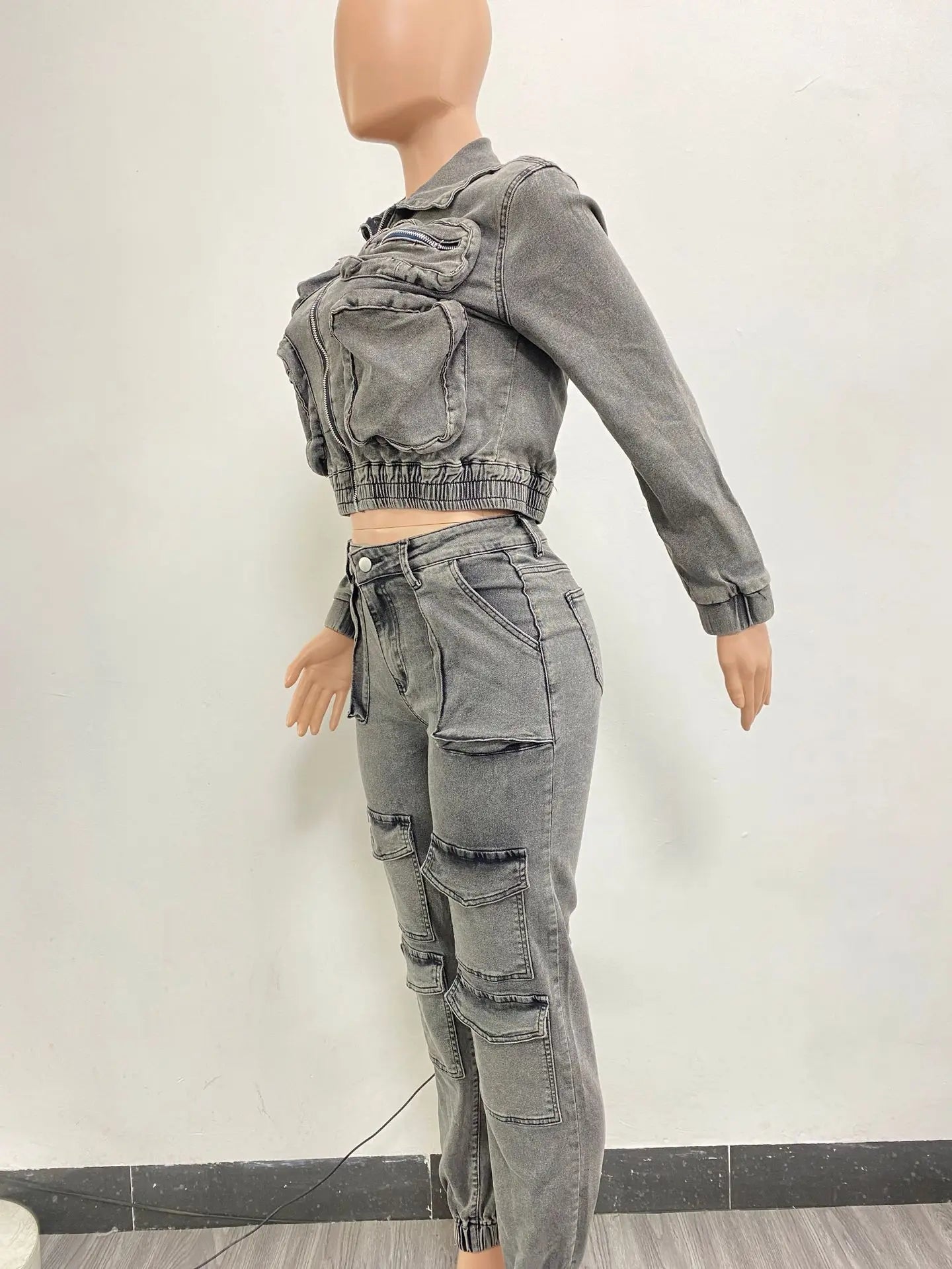 Women’s denim pant set with long sleeve zipper top, cargo ankle pants, and spliced slim fit design from Showlu Fashion.