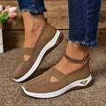 Lightweight women's slip-on sneakers from Showlu Fashion with breathable mesh, soft sole, and low-top vulcanized design for walking comfort.