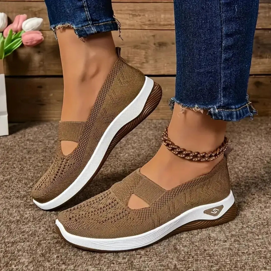 Lightweight women's slip-on sneakers from Showlu Fashion with breathable mesh, soft sole, and low-top vulcanized design for walking comfort.