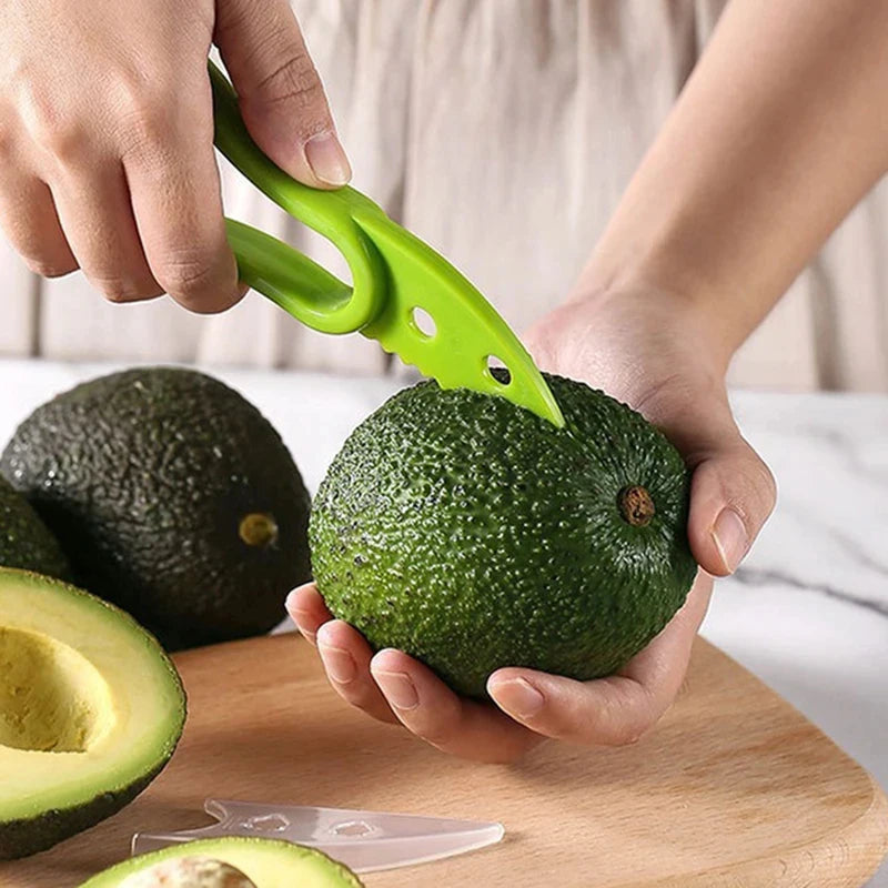 Showlu Smart General 3 in 1 avocado tool with peeling, pitting, and slicing functions, shown in a close-up image.