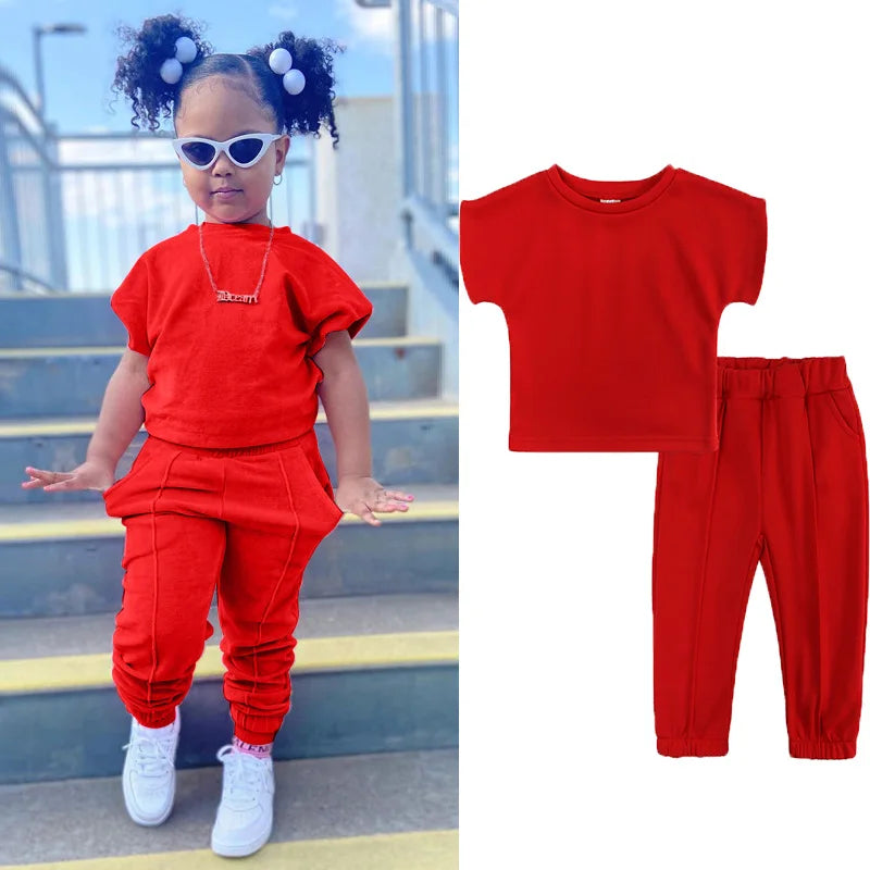 Kids Tales girls' 2-piece cotton T-shirt and pants set for ages 1-6, featuring playful prints and comfortable fit.