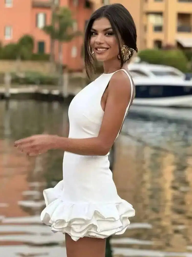White short sleeveless bodycon dress with ruffle backless design, perfect for summer parties, from Showlu Fashion.