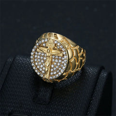 A gold-toned stainless steel ring featuring an iced-out crucifix design with cubic zirconia stones.