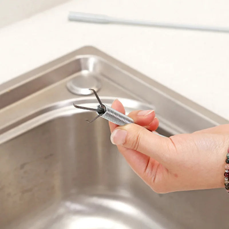 Showlu Smart General drain snake hair remover tool with flexible coil and handle for clearing clogged drains.