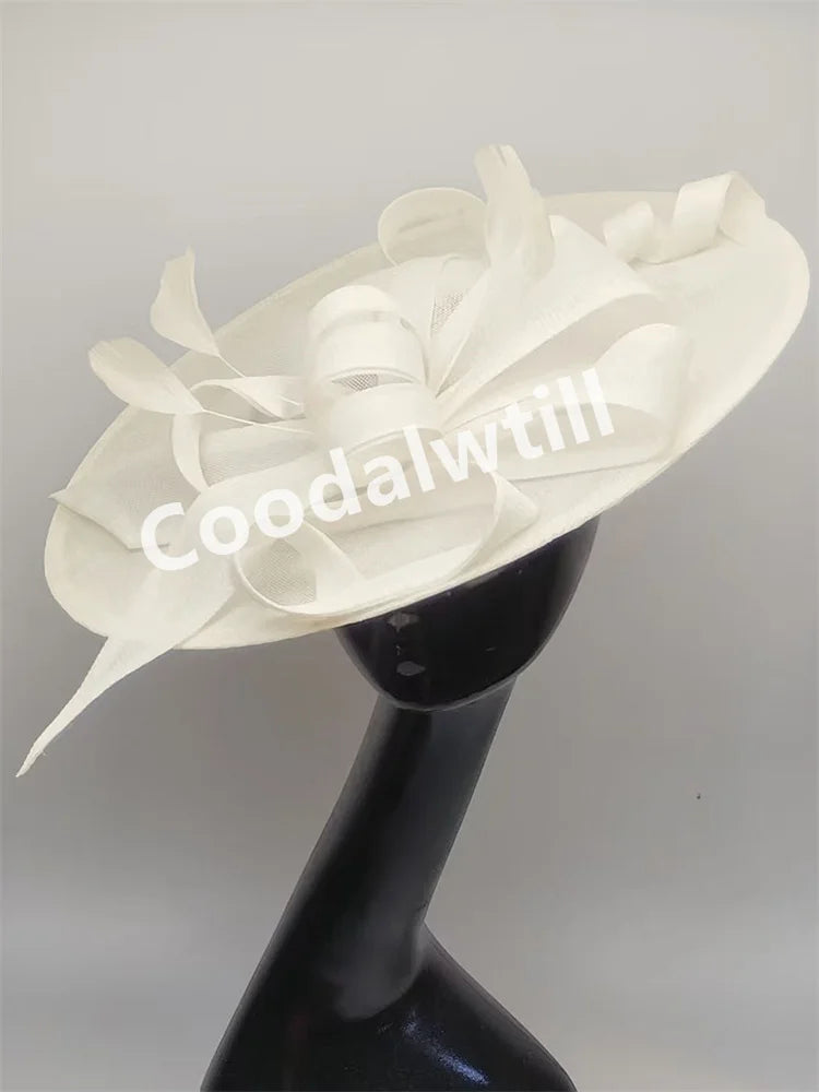 Pink Derby fascinator hat headband with large decorative bow for bridal, wedding, or formal events, elegant millinery headpiece.