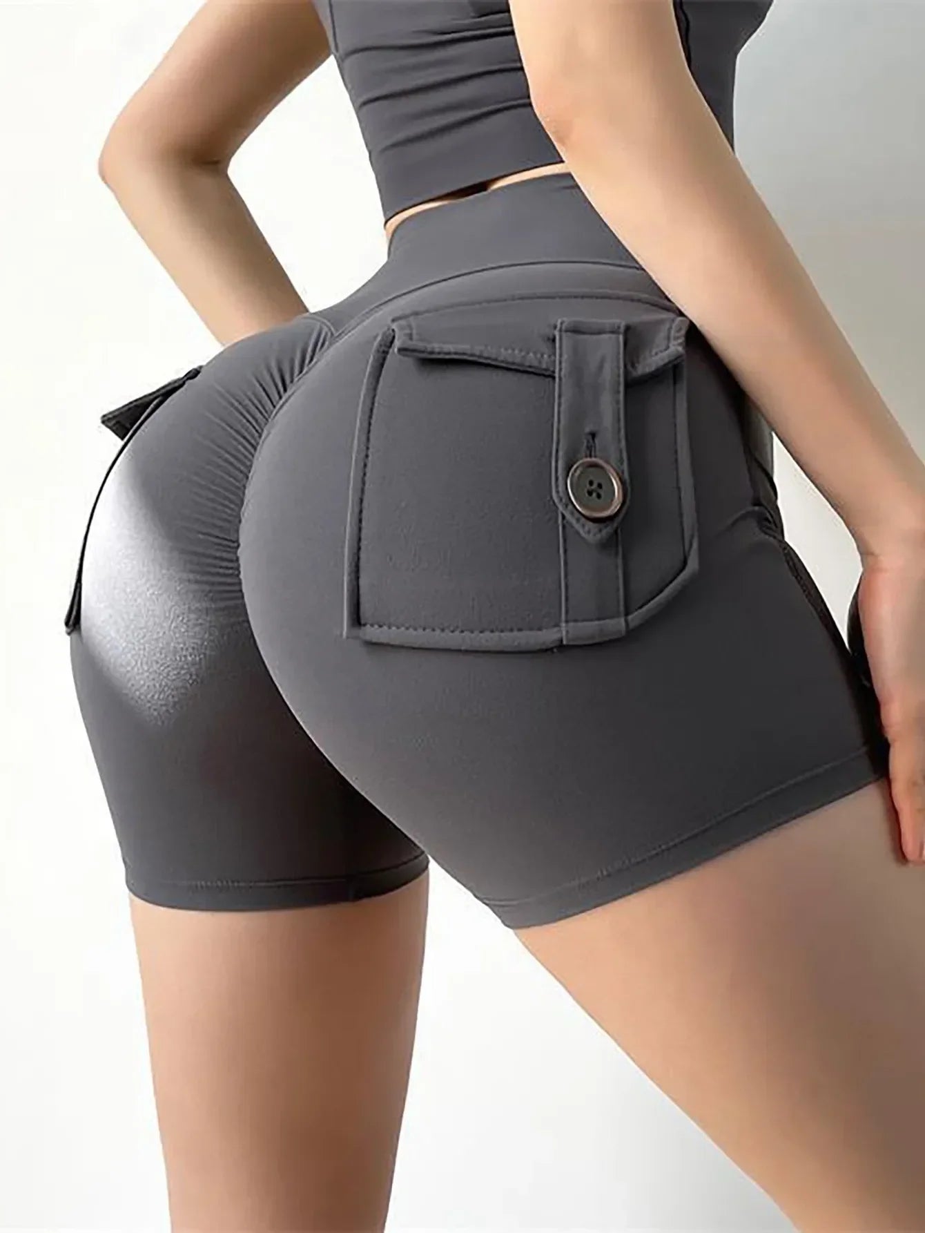 Women's high waist peach yoga shorts with pockets from SANWOOD, featuring a flattering fit and butt lifting design.