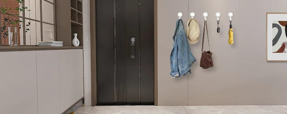 Showlu Smart General wall mounted storage hooks on a wall, ideal for organizing and hanging items in a home or office space.