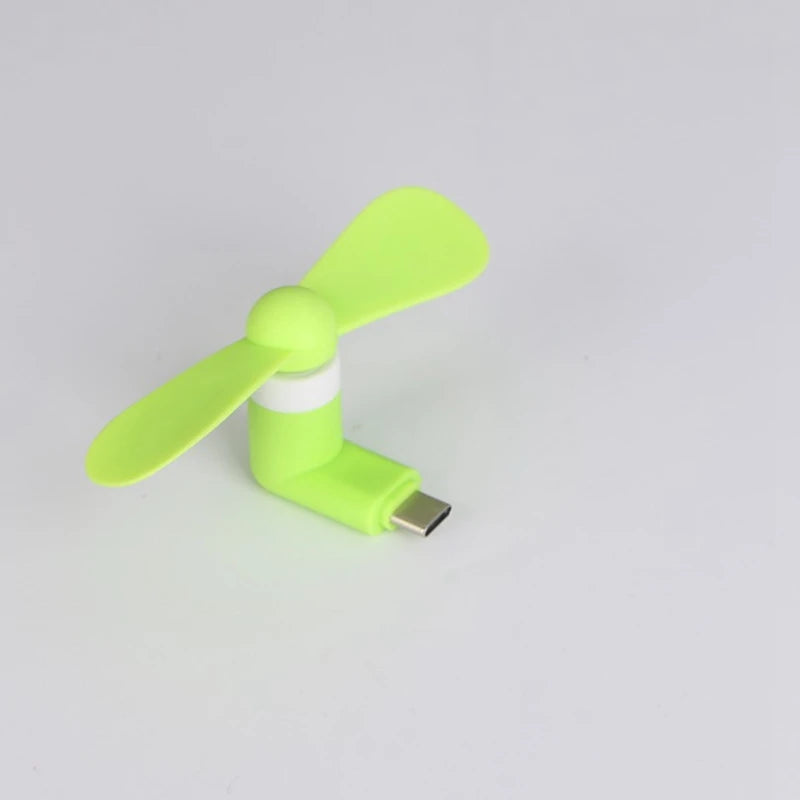 Showlu Smart General USB mini fan with compact design and adjustable blades, perfect for portable cooling on the go.