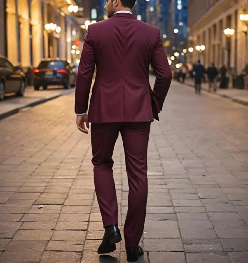 Maroon men's 3-piece slim-fit wool blend tuxedo suit featuring a tailored jacket, vest, and trousers, ideal for formal occasions.