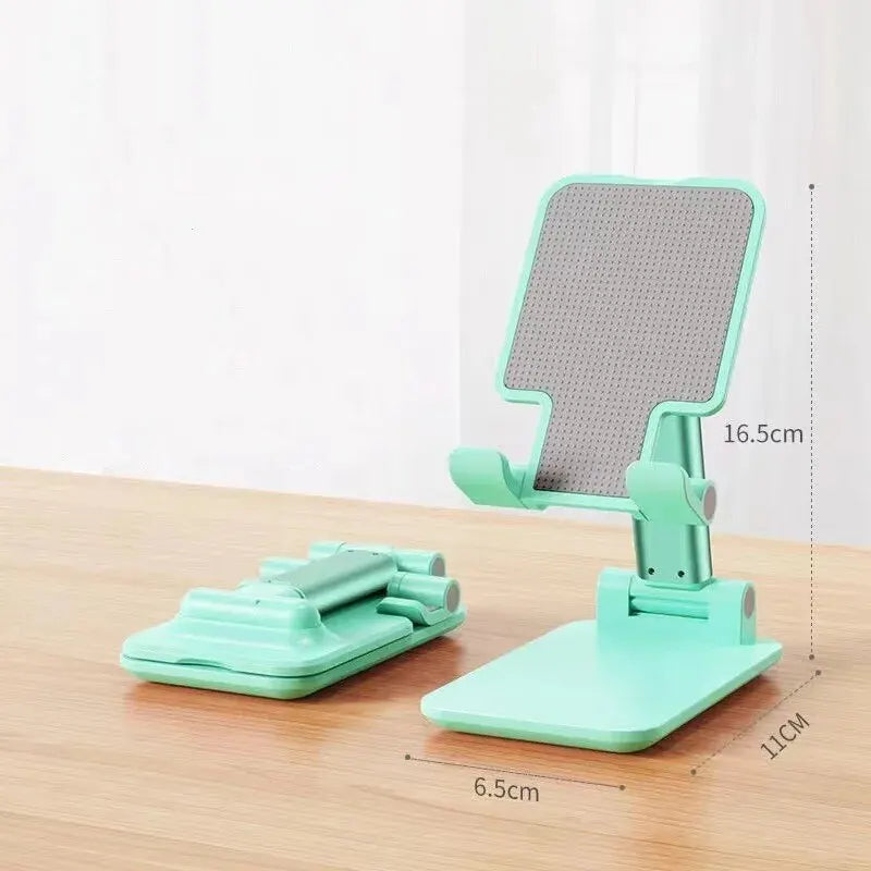 Flexible foldable phone holder stand with adjustable support, compatible with all smartphones for desktop use.