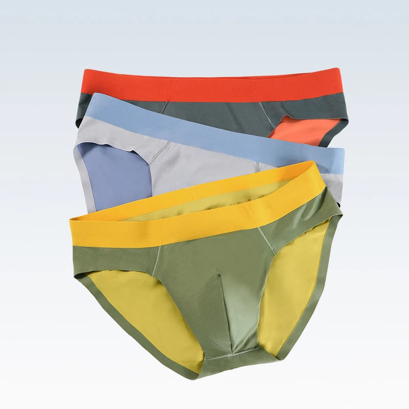Showlu Men's Ice Silk Seamless Briefs, breathable low waist underwear, soft and comfortable fit, shown on a model.