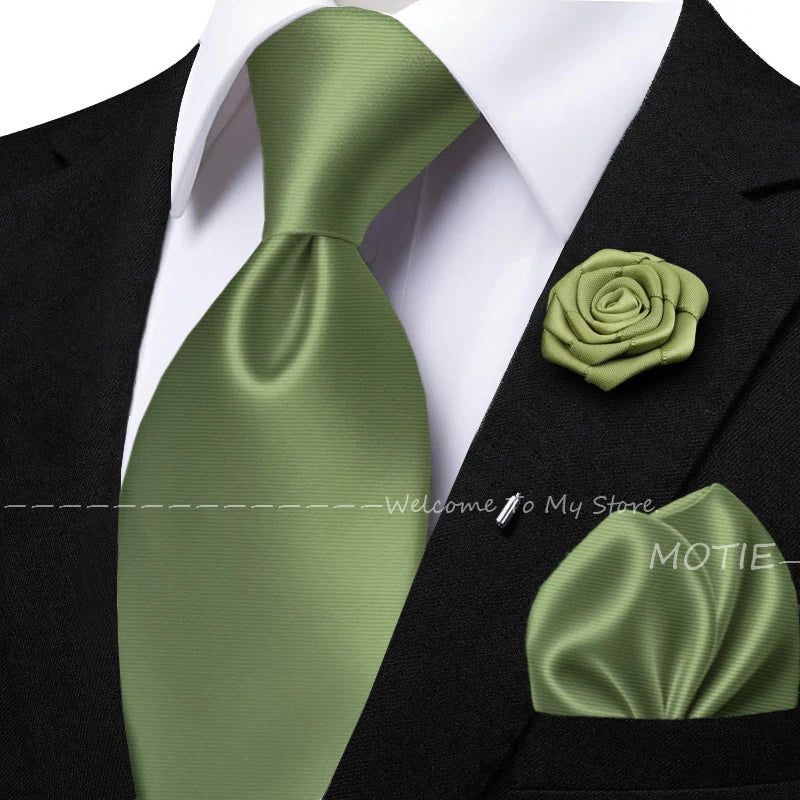 Men's sage green tie set with pocket square, flower brooch, cufflinks, and collar accessory for wedding or daily wear.