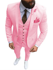 A man wears a slim-fit pink three-piece suit with a white shirt, brown tie, and white sneakers.