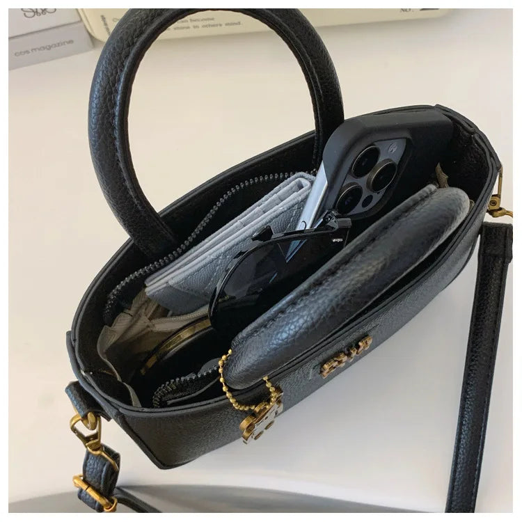 Luxury minimalist phone pouch by 1170uf-he featuring a sleek shoulder crossbody bag with modern design and compact size.