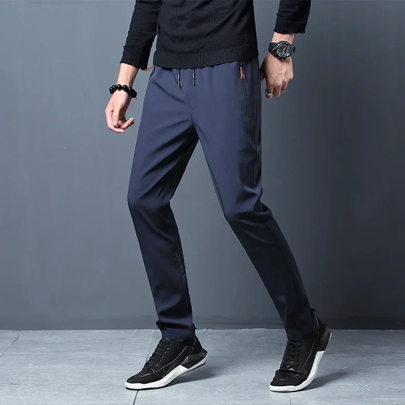 Lightweight SHOWLU men's straight slim fit casual jogger pants laid flat, showing their stylish design and comfortable fit.