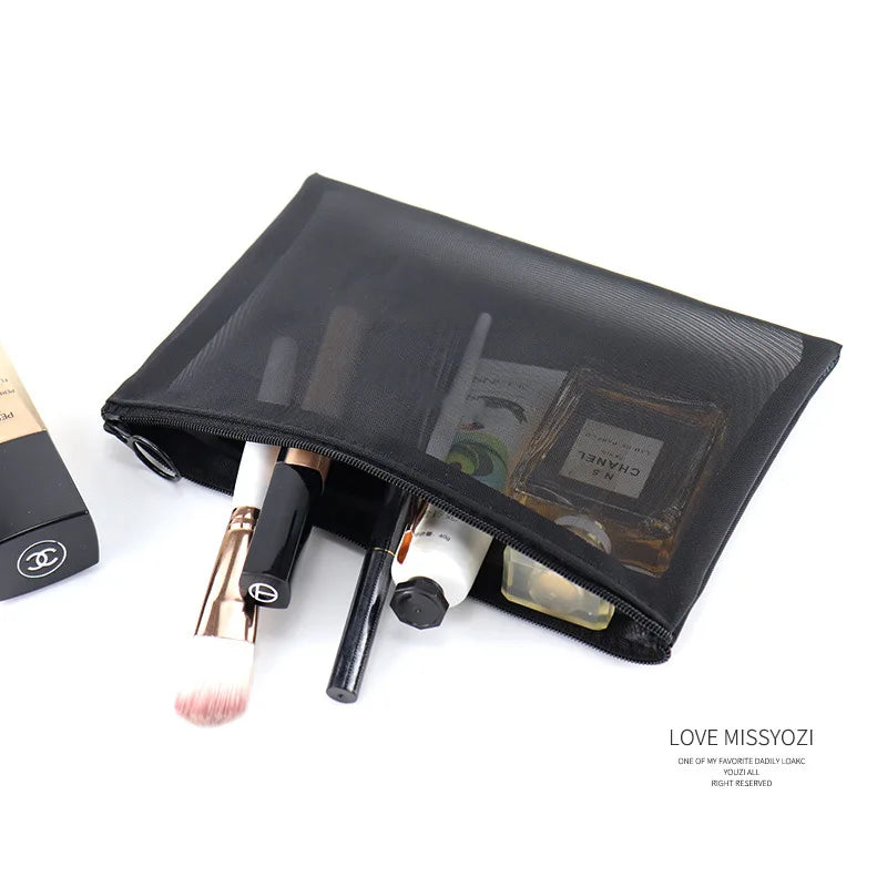 Large black portable outdoor travel makeup bag with transparent mesh compartments for storage and organization.