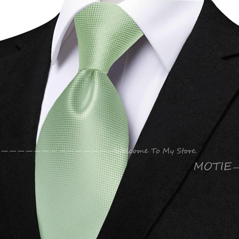 Men's solid sage green tie set with pocket square, flower brooch, cufflinks, and collar accessory for wedding or daily wear.