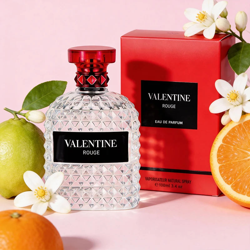 Unisex Eau De Parfum by Showlu Fashion with Mandarin Orange and Bergamot, 3.4 oz, featuring a sleek glass bottle and orange-hued liquid.