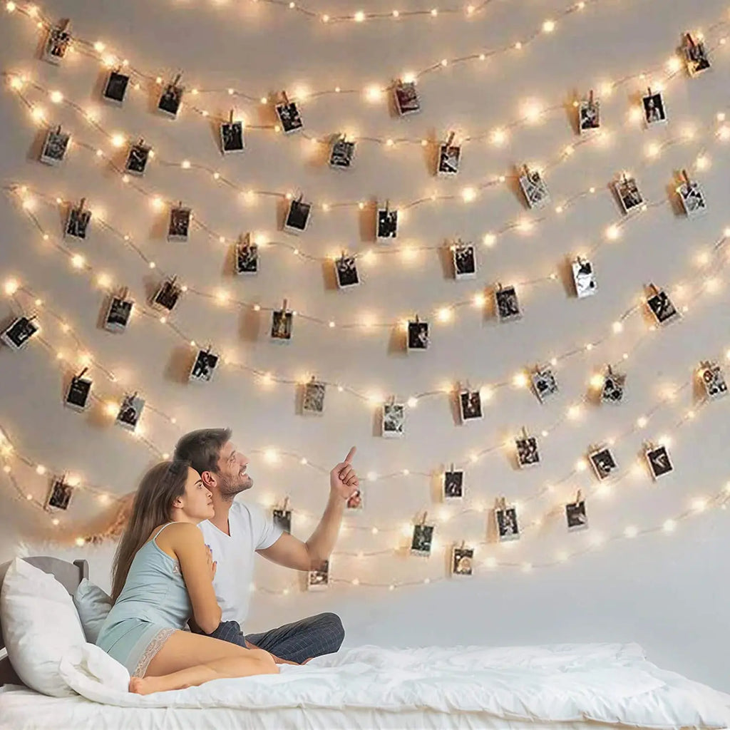 Showlu Smart General LED photo clip string lights hanging with clips and glowing softly, ideal for decorative lighting.