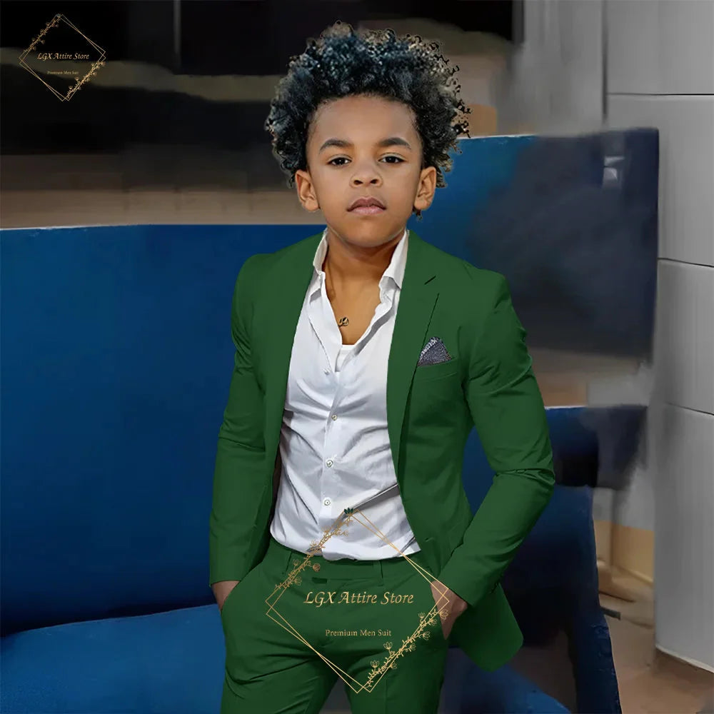 Boy wearing orange slim fit 2-piece suit by SHOWLU FASHION STORE, featuring a single-breasted twill jacket and matching pants.